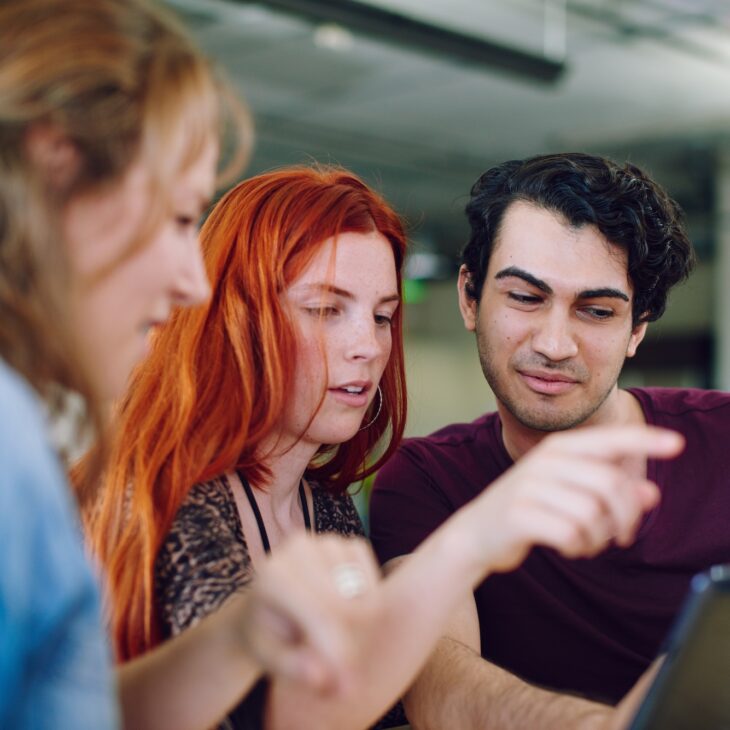 unposed-group-of-creative-students-brainstorming